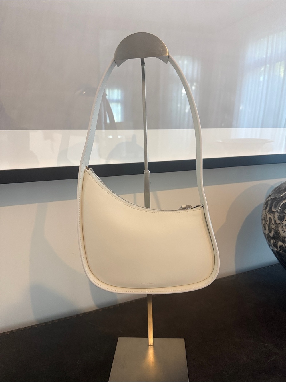 The Row half moon bag